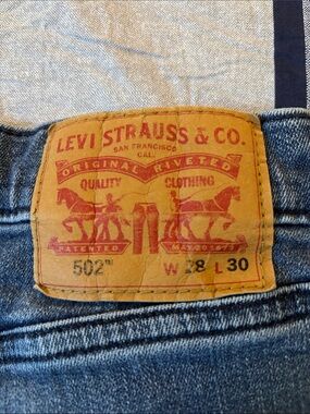 Levi's 502 stretch Jeans in Blue with Tan Patch